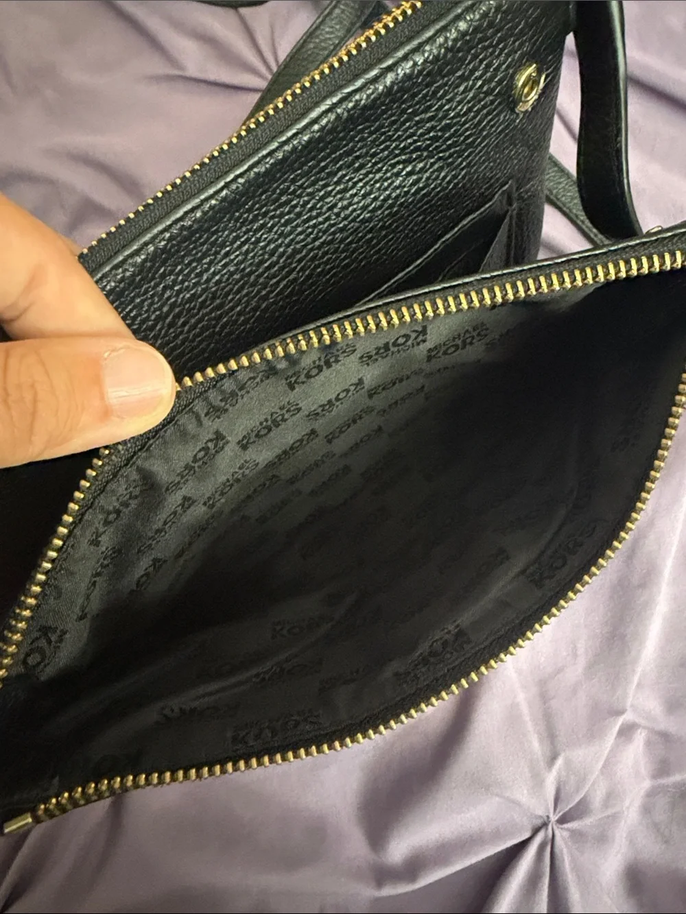 Michael Kors Black Pebbled Leather Crossbody with Gold MK Emblem.